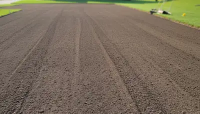 Expert graded soil prepared for professional sod installation in Olathe, KS lawn by Chop Chop Landscaping